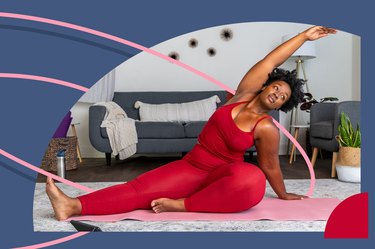 a person in their living room wearing red leggings and a red tank top doing a side stretch as part of a 4-week mobility challenge on a pink yoga mat in front of a gray couch