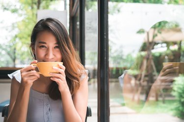 woman drinking tea in cafe