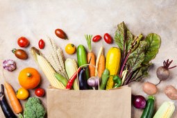 healthy autumn vegetables in paper grocery bag